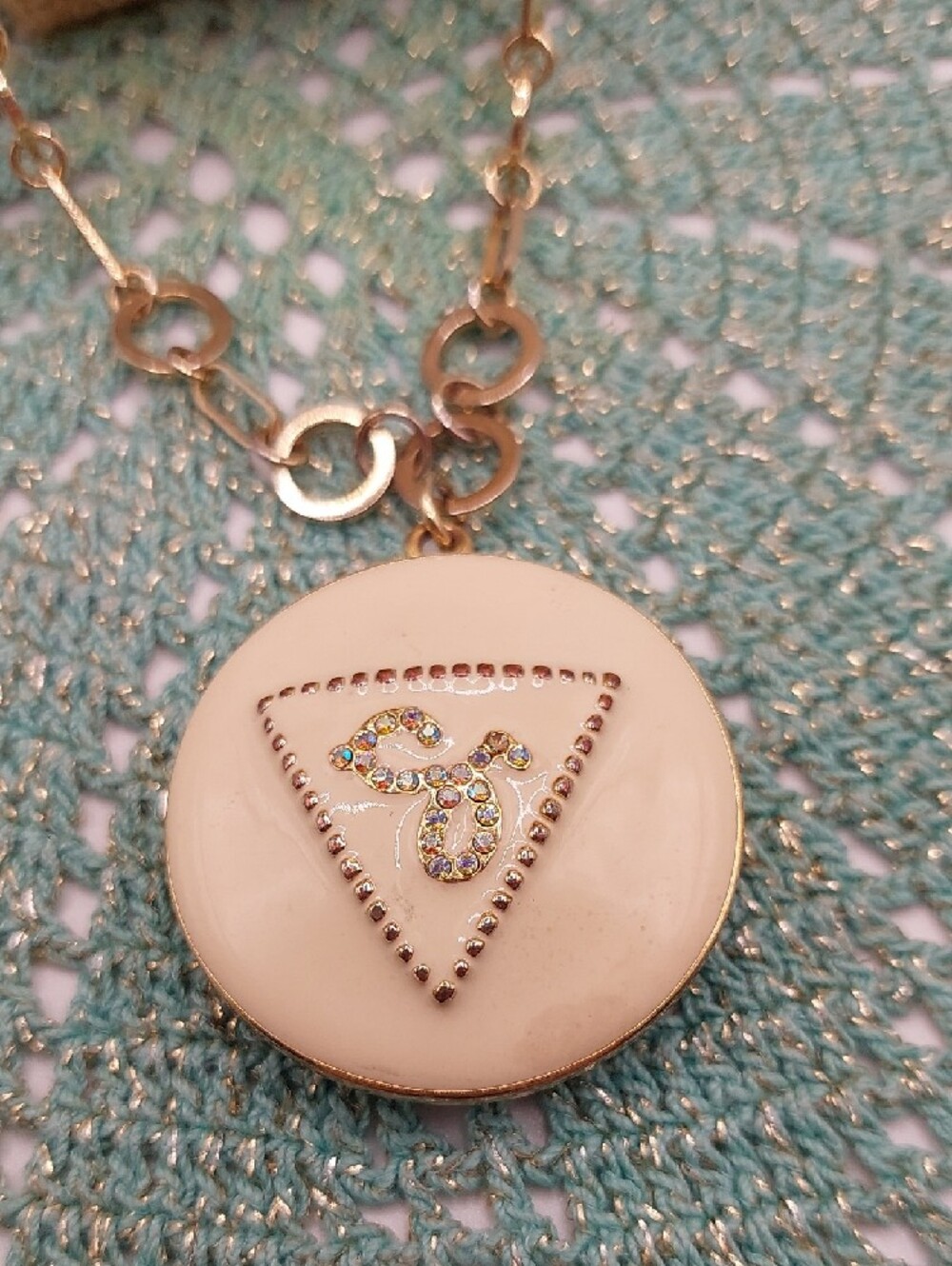 GUESS Blingy AB Gold-Tone Long Pendant Necklace with Cream Enamel Locket - Picture 4 of 14